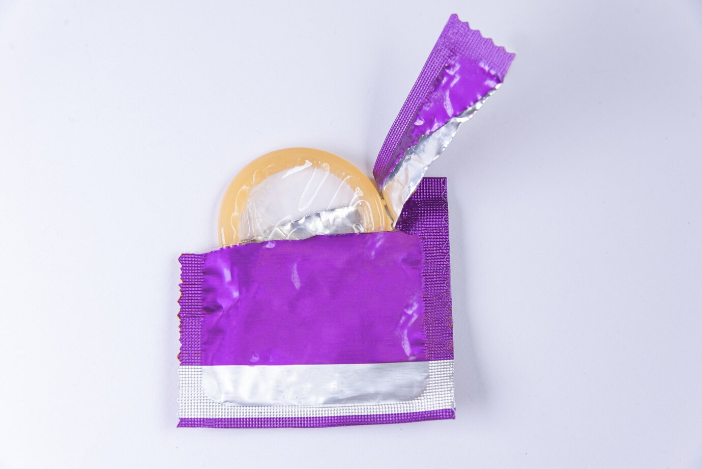 rozbalený kondom